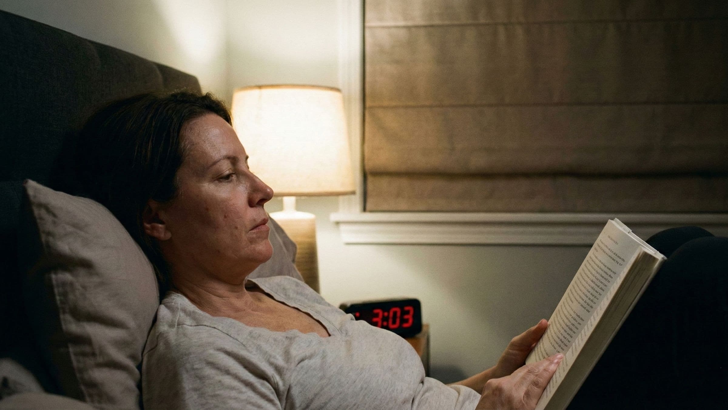 Digital clock showing 3:03 AM representing menopause insomnia